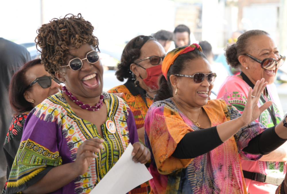 Women singing in joy filled musical performance